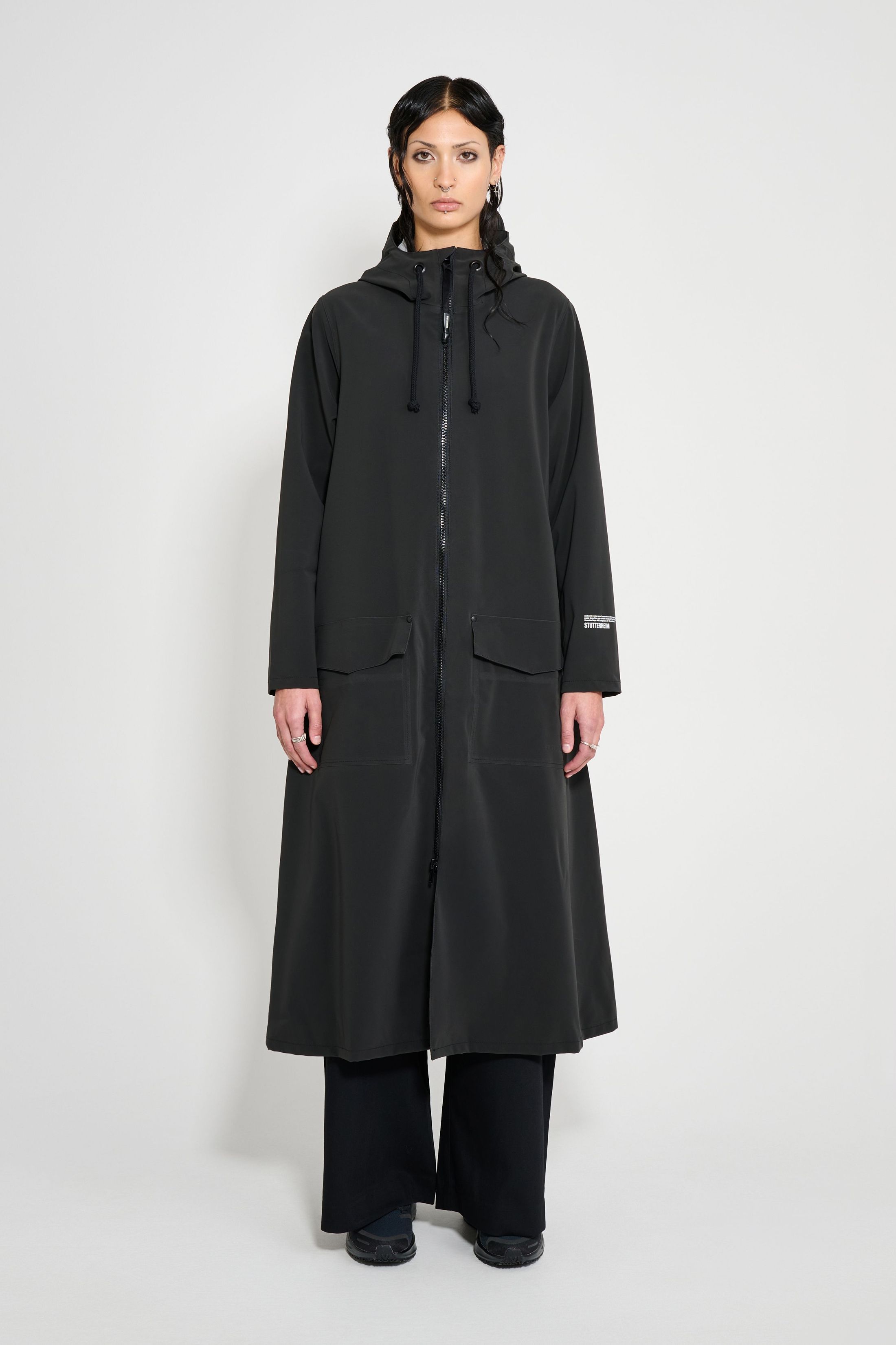 stutterheim mosebacke long patch raincoat black women jackets long-raincoats
