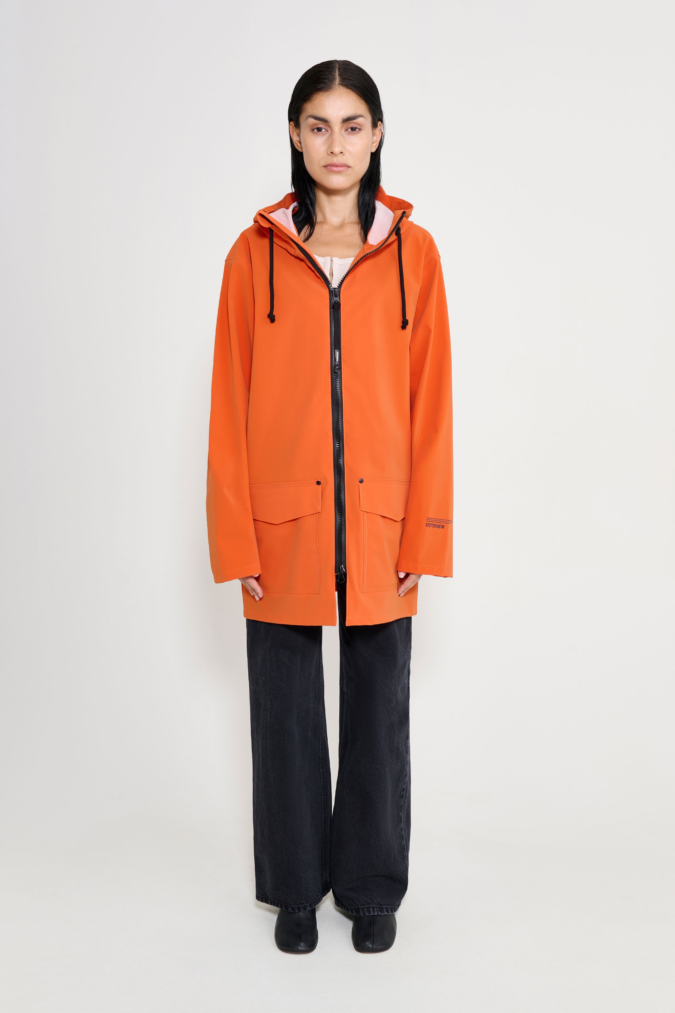 stutterheim stockholm patch raincoat pumpkin women jackets raincoats