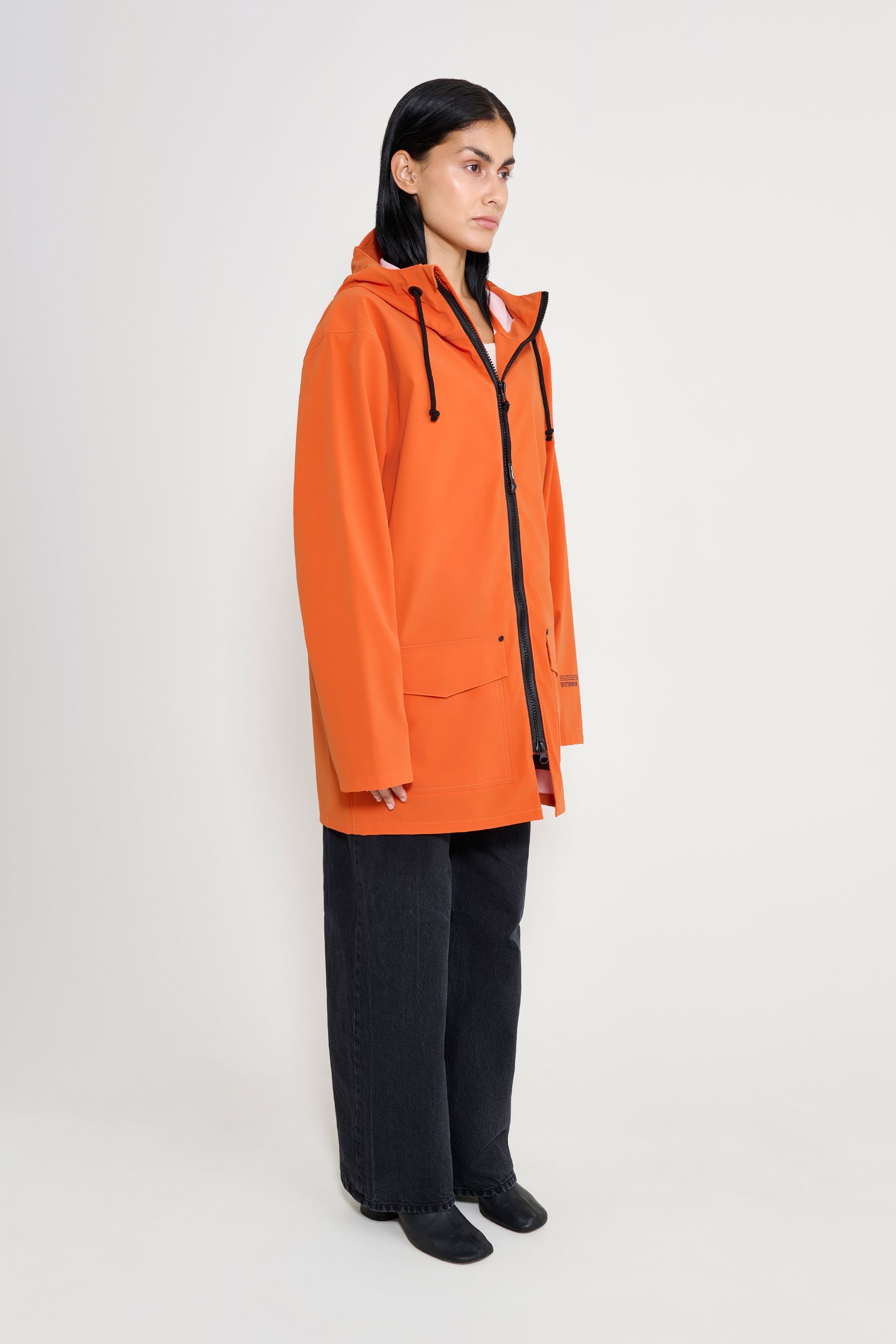 stutterheim stockholm patch raincoat pumpkin women jackets raincoats